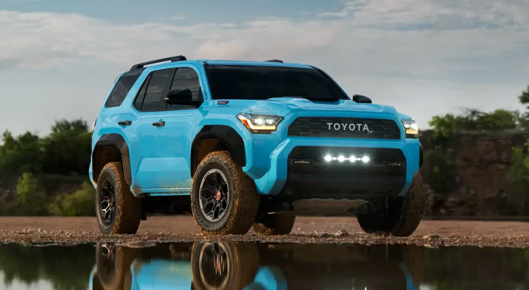Blue Toyota SUV parked near a reflective surface.